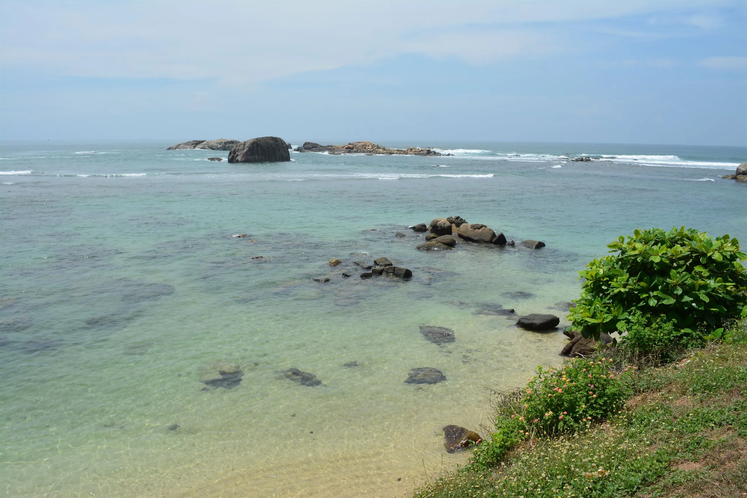A turquoise cove between rocky headlands on the south coast